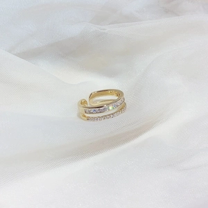 Elegant gold double-layer adjustable ring with sparkling cubic zirconia on white mesh