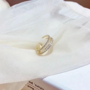 Double-layered gold-plated ring with shimmering white zircon stones and adjustable open band