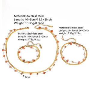 Detail view of stainless steel double-layer jewelry set with red crystal stones