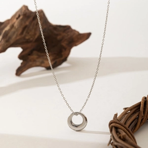 Polished silver ring necklace with minimalist circle pendant on fine link chain
