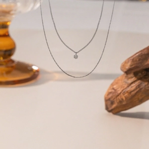 Double-layered titanium steel necklace with a round sparkling pendant in a luxury style