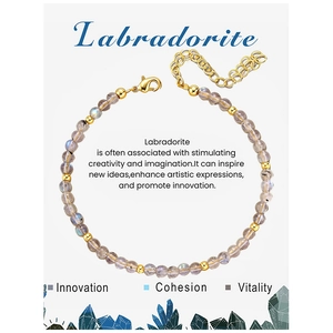 Macro detail of 4mm labradorite beaded bracelet with gold lobster clasp and heart charm