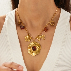 Vintage gold-plated stainless steel necklace featuring resin heart and bow pendants