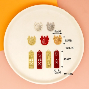 Detail view of alloy Chinese New Year charms with size and weight measurements.