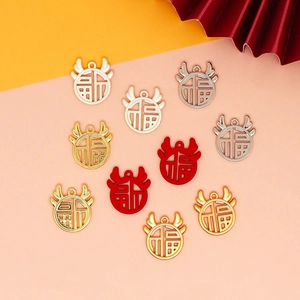Detail showing various colors of Dragon Year 'Fu' fortune charms for DIY jewelry