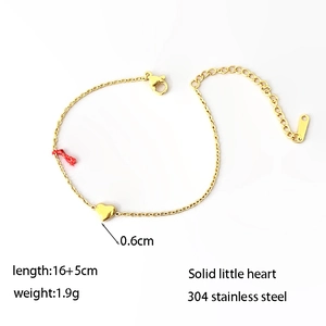 Minimalist gold stainless steel bracelet featuring a mini solid heart pendant on white background