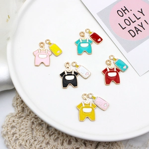 Detailed view of colorful enamel baby romper and bottle charms for DIY jewelry