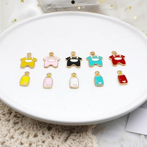 Detailed view of colorful baby clothes and bottle enamel alloy charms for DIY crafts