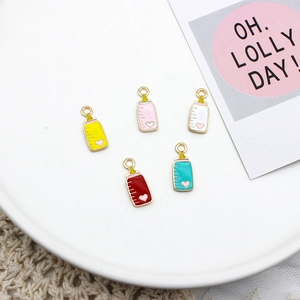 Close-up of baby bottle charms in multiple colors featuring a small heart design