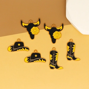 Detailed macro view of western cowboy style enamel charms for DIY jewelry