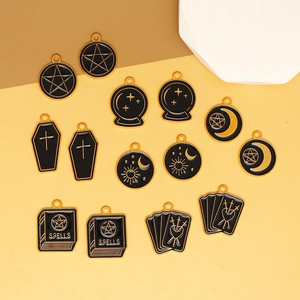 Detail view showing variety of Gothic occult tarot enamel charms for DIY jewelry making