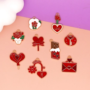 Detailed close-up of Valentine's Day red enamel heart and rose charms for DIY jewelry making