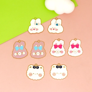 Collection of cute enamel animal charms including bunnies and bears for DIY jewelry.