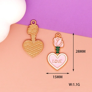 Detail of pink enamel heart and rose charm with dimensions 28x15mm and 1.1g weight