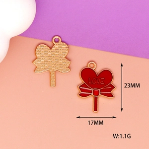 Detailed view of red heart lollipop enamel charm showing 23mm x 17mm measurements
