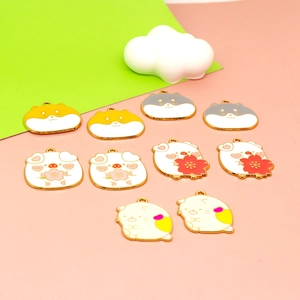 Close-up of cute cartoon animal enamel pendants for DIY necklace and bag decoration