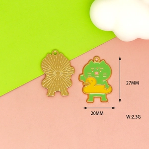 Detail shot of green cartoon bear alloy enamel charm with 27x20mm dimensions for DIY jewelry