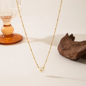 Elegant French gold titanium necklace with a delicate white shell peach blossom pendant