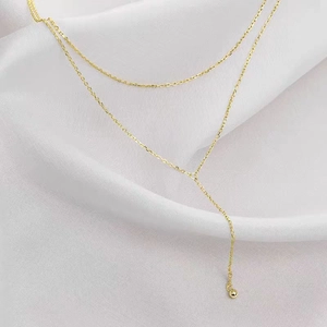 Minimalist gold-plated Y-shaped double-layer titanium necklace with a polished bead pendant