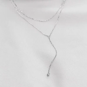 Minimalist silver layered Y-shaped necklace with delicate beads in premium titanium steel