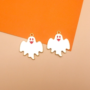 Close-up of white enamel ghost charms for Halloween DIY jewelry, alloy drip oil pendants