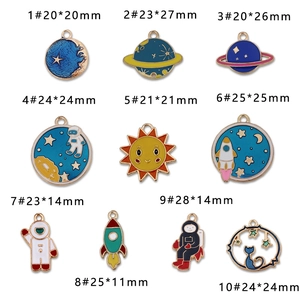 DIY enamel outer space charms with astronauts and planets for creative jewelry making