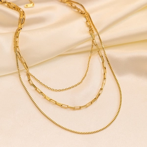 Three-layer 18K gold plated stainless steel necklace featuring mixed chain styles on silk