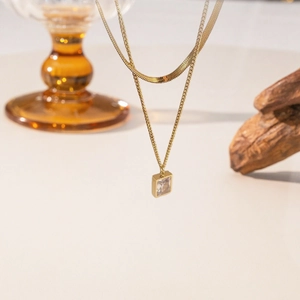 Double layered gold titanium steel necklace with flat blade chain and square zircon pendant