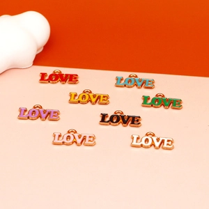 Close-up of colorful enamel LOVE letter charms for DIY jewelry making and keychains.
