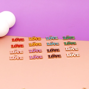 Selection of colorful enamel LOVE charms for DIY jewelry and keychain making projects