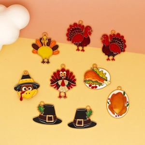 Close-up view of Thanksgiving turkey and pilgrim hat enamel alloy jewelry charms