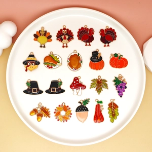 Detailed view of Thanksgiving alloy charms with turkey and pumpkin designs for DIY crafts
