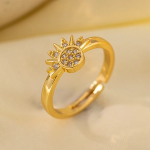 Detail shot of vintage sunburst open ring with gold plating and cubic zirconia crystals