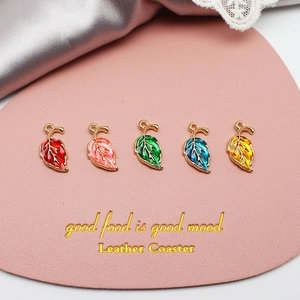 Colorful DIY gold alloy leaf charms with transparent enamel for jewelry making.