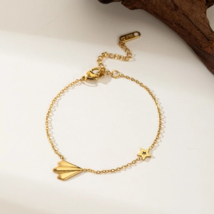 Bracelet doré en acier inoxydable avec breloques étoile et avion, ajustable