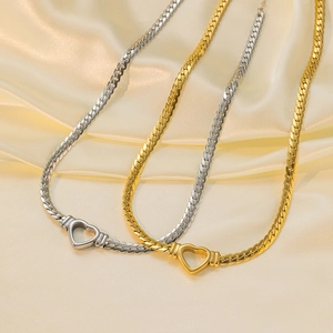 Flat snake chain necklaces with heart-shaped connector in gold, silver and two-tone finishes