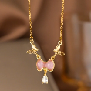 Elegant gold necklace with pink butterfly pendant and teardrop zircon crystal