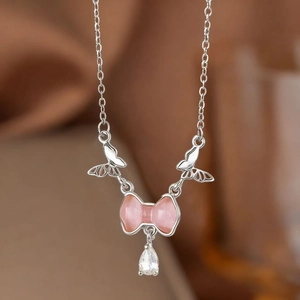 Silver butterfly tassel necklace with pink cat eye stone and teardrop pendant charm