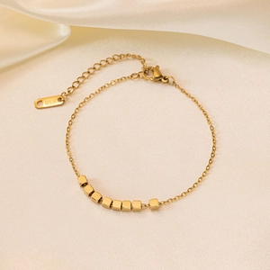 Elegant 18K gold-plated titanium steel bracelet featuring nine minimalist sugar cube beads