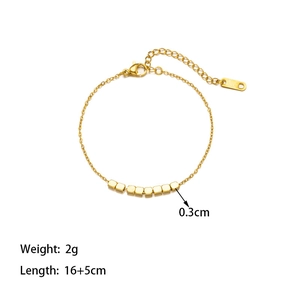 Detail of gold titanium steel bracelet with seven square beads and adjustable lobster clasp