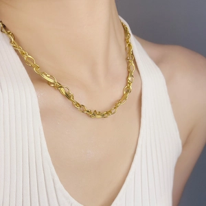 Elegant gold woven snake chain necklace for women shown on a model in natural light