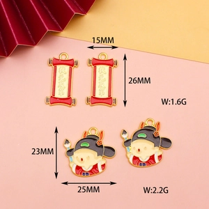 Close-up of DIY alloy enamel scholar and scroll charms with size and weight specifications