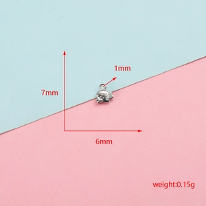 Close-up detail showing precise dimensions of a silver stainless steel strawberry charm