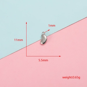 Detailed view of polished stainless steel bean charm with dimensions and weight info