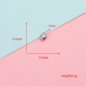 Detailed view of small stainless steel heart pendant with precise measurements.