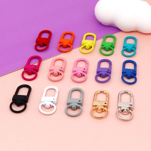 Close-up of colorful swivel lobster clasps in various painted finishes for DIY crafts