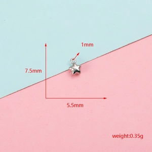 Close-up of a small polished stainless steel star charm pendant for DIY jewelry making