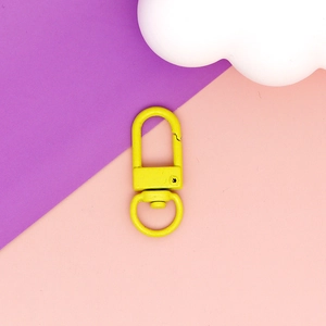 Close-up of vibrant yellow zinc alloy swivel lobster clasp for DIY accessories