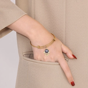 Adjustable gold-plated stainless steel bangle with Hamsa hand pendant for women