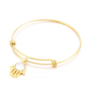 Adjustable gold stainless steel bangle featuring a Hamsa hand charm with clear crystal.